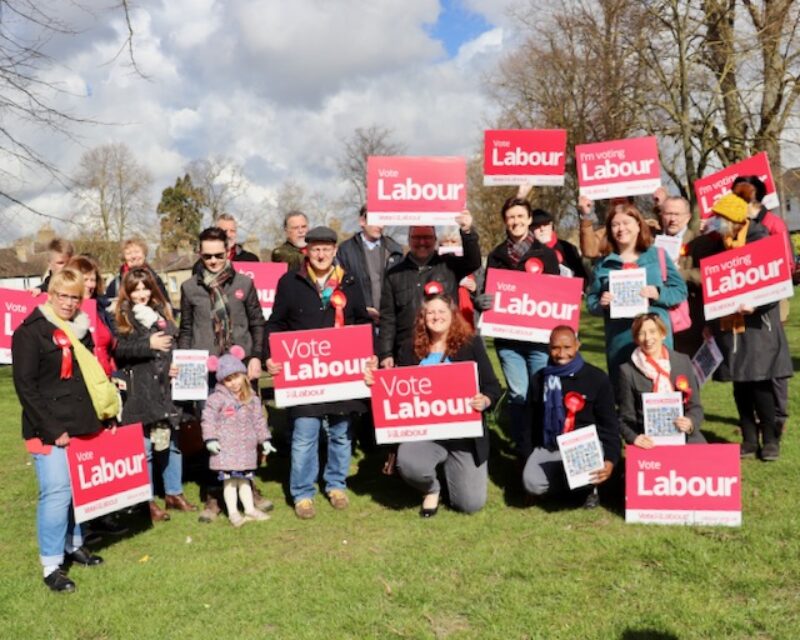 Cambridgeshire Labour members holding Vote Labour placards